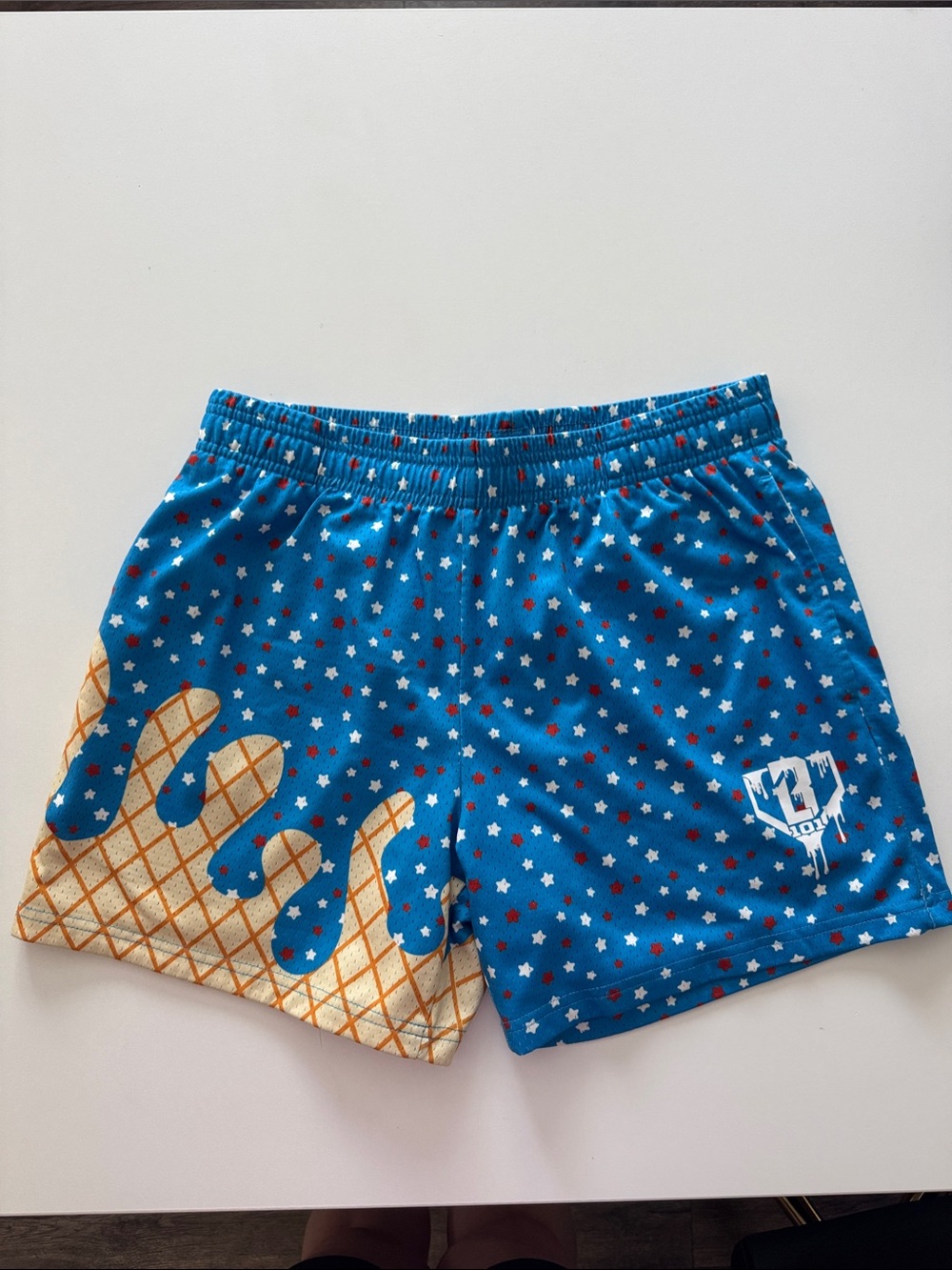 Blue Star Print Athletic Shorts with Gold Waffle Drip Detail